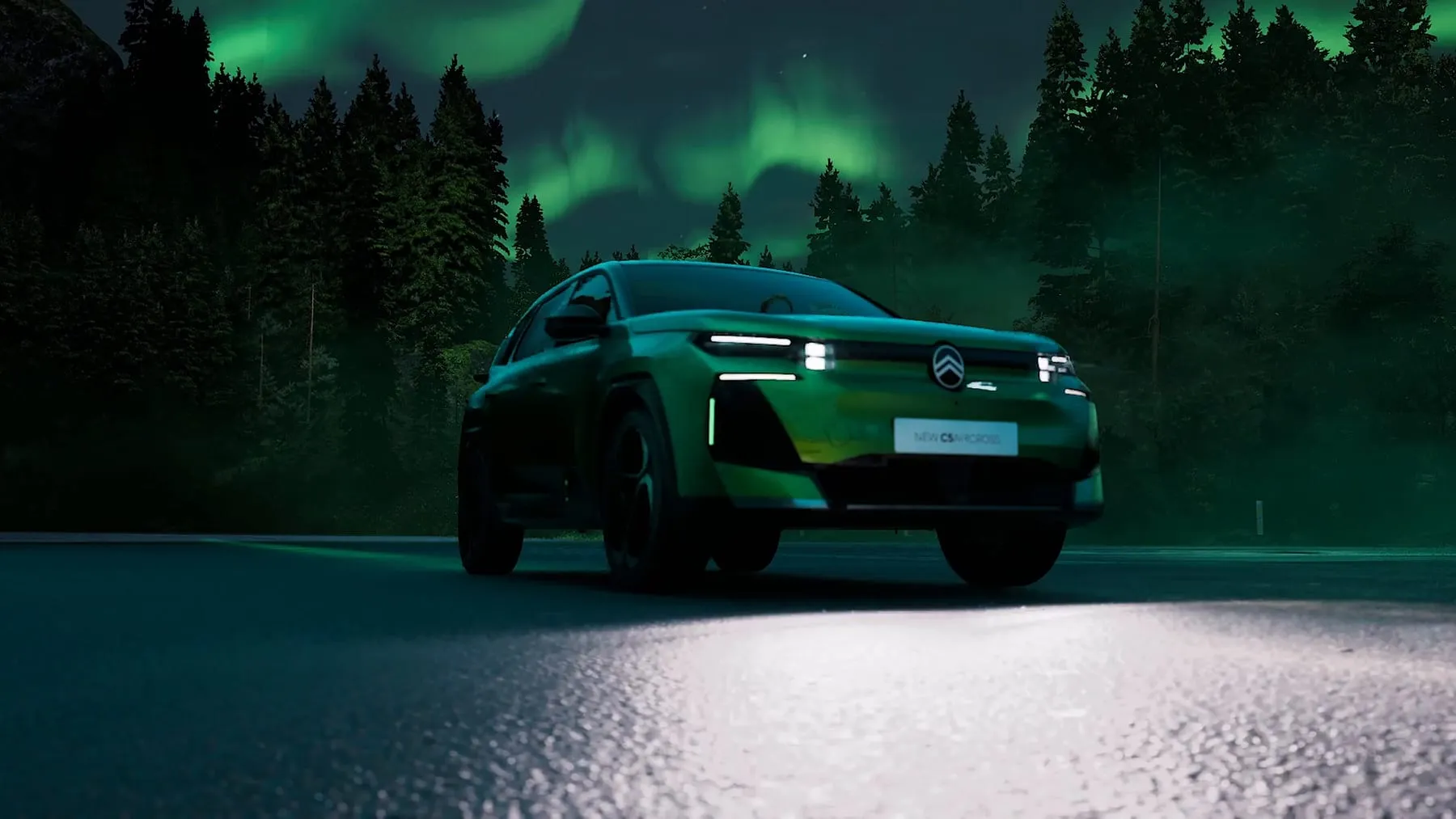 The C5 Aircross on a forest road at night under a green aurora