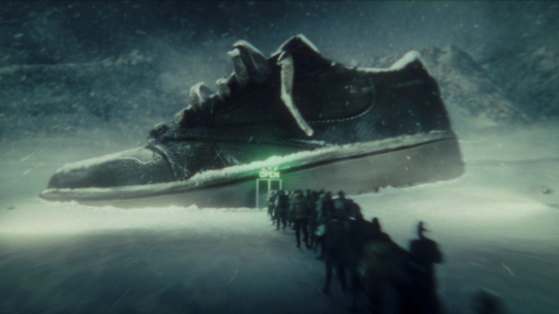 A giant sneaker rising out of the snow, a crowd walking towards it