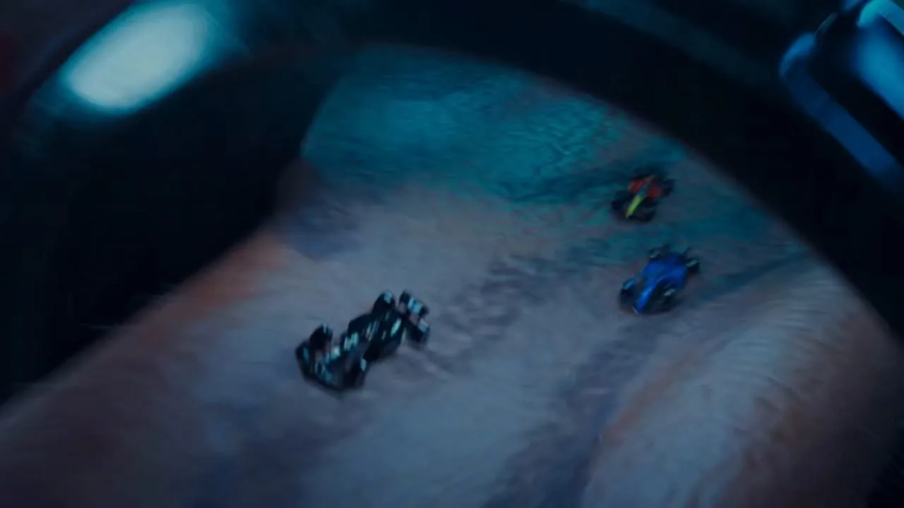 Two Formula cars racing across the skin of a forearm