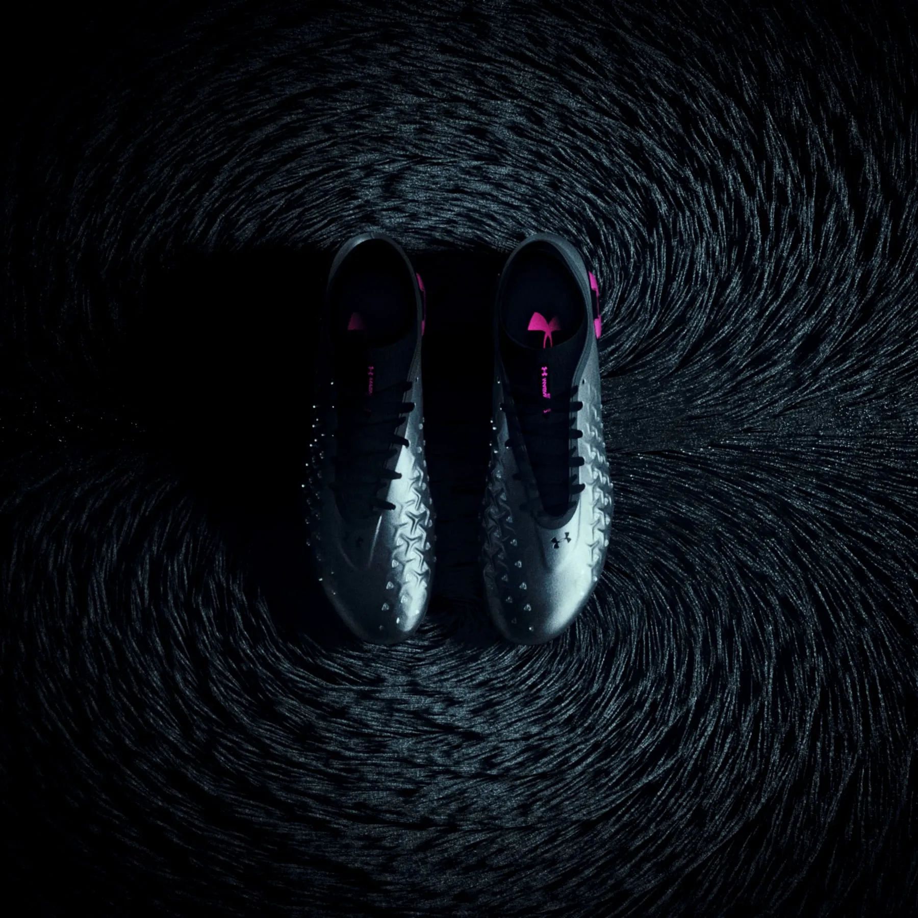 A pair of Magnetico boots standing in a dense field of iron filings