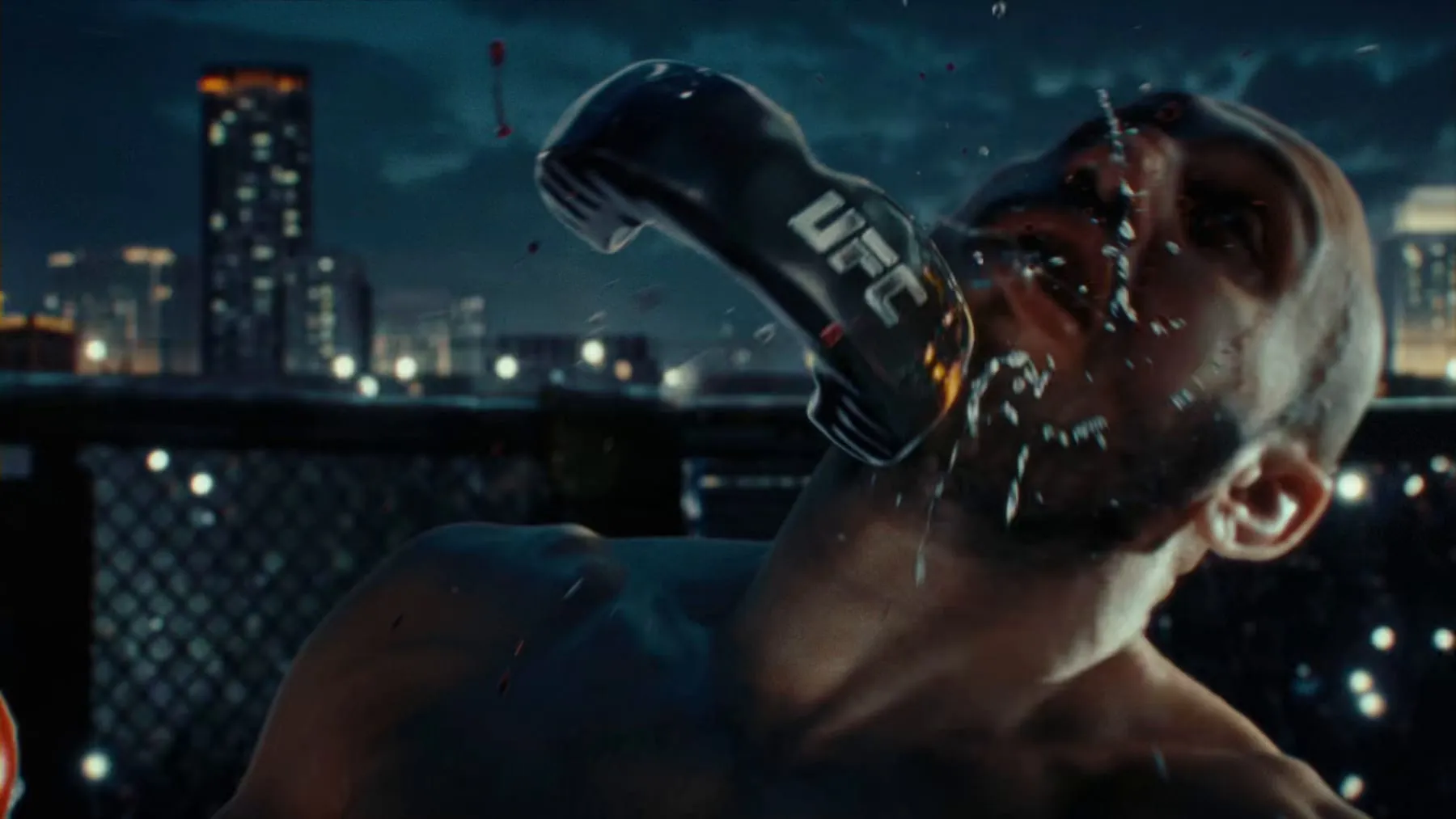 The instant of a punch landing, sweat coming off the impact